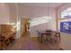 Dining area with hardwood floors, vintage piano, and large windows at 2044 Glorieta Ln, Las Vegas, NV 89134