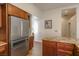 Sleek kitchen with stainless steel refrigerator and granite countertops at 2044 Glorieta Ln, Las Vegas, NV 89134