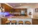 Island kitchen with granite countertops and breakfast bar at 2044 Glorieta Ln, Las Vegas, NV 89134