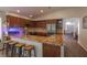 L-shaped kitchen with granite countertops and hardwood floors at 2044 Glorieta Ln, Las Vegas, NV 89134