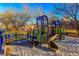 playground featuring a slide, climbing structures, and sandy play area at 2044 Glorieta Ln, Las Vegas, NV 89134