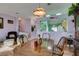 Bright dining room with hardwood floors and a charming wooden table at 2091 Poppywood Ave, Henderson, NV 89012