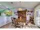 Bright dining room with hardwood floors and a charming wooden table at 2091 Poppywood Ave, Henderson, NV 89012