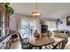 Spacious dining area with hardwood floors and view to the living room at 2091 Poppywood Ave, Henderson, NV 89012