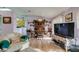 Open concept living and dining area with hardwood floors at 2091 Poppywood Ave, Henderson, NV 89012