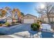 Front view of a single-story house with a two-car garage at 2091 Poppywood Ave, Henderson, NV 89012