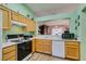 Kitchen with oak cabinets and gas range at 2091 Poppywood Ave, Henderson, NV 89012