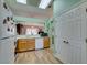 Kitchen with oak cabinets, and view to dining area at 2091 Poppywood Ave, Henderson, NV 89012