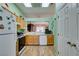 Kitchen with oak cabinets, and view to dining area at 2091 Poppywood Ave, Henderson, NV 89012