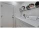 Laundry room with washer, dryer, and shelving at 2091 Poppywood Ave, Henderson, NV 89012