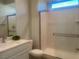 Clean bathroom featuring a walk-in shower and updated white vanity at 2110 Millergrove Ave, North Las Vegas, NV 89086