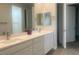 Double vanity bathroom with quartz countertops and modern fixtures at 2110 Millergrove Ave, North Las Vegas, NV 89086