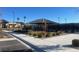 Community pavilion with tables, landscaping, and nearby tennis courts at 2110 Millergrove Ave, North Las Vegas, NV 89086