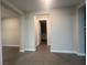 Neutral-toned hallway with tile flooring and access to other rooms at 2110 Millergrove Ave, North Las Vegas, NV 89086