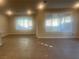 Spacious living room with large windows and tile flooring at 2110 Millergrove Ave, North Las Vegas, NV 89086