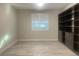 Room with hardwood floors, a window with shutters, and large built-in shelves at 2110 Millergrove Ave, North Las Vegas, NV 89086