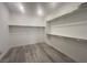 Spacious walk-in closet with ample shelving and hanging space at 2110 Millergrove Ave, North Las Vegas, NV 89086