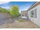 Backyard with gravel landscaping and covered patio at 2236 Waterton Rivers Dr, Henderson, NV 89044