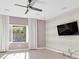 Relaxing living room featuring natural light and a ceiling fan at 2236 Waterton Rivers Dr, Henderson, NV 89044