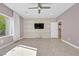 Spacious living room with large TV and ceiling fan at 2236 Waterton Rivers Dr, Henderson, NV 89044