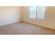 Bright bedroom with neutral carpeting and large window at 2254 Cold Canyon Ave, North Las Vegas, NV 89086