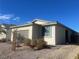 Single story house with brown garage door and neutral color scheme at 2254 Cold Canyon Ave, North Las Vegas, NV 89086