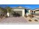 Single-story house with brown garage door and landscaped front yard at 2254 Cold Canyon Ave, North Las Vegas, NV 89086