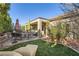 Landscaped backyard with patio furniture and lawn at 2401 Weaverville Dr, Henderson, NV 89044