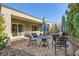 Relaxing backyard patio with seating area and brick pavers at 2401 Weaverville Dr, Henderson, NV 89044