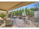 Spacious backyard patio with seating area and brick pavers at 2401 Weaverville Dr, Henderson, NV 89044