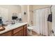 Clean bathroom with granite countertop, bathtub, and shower at 2401 Weaverville Dr, Henderson, NV 89044