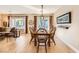 Dining room with wood table and chairs, open to kitchen at 2401 Weaverville Dr, Henderson, NV 89044