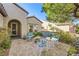 Charming front patio with seating area and brick pavers at 2401 Weaverville Dr, Henderson, NV 89044