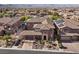 Aerial view of a neighborhood featuring lush greenery, tile roofs and mountain views at 2717 Mona Lisa St, Henderson, NV 89044