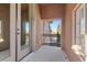 Outdoor balcony with tiled flooring, stucco walls, and wrought iron railing at 2717 Mona Lisa St, Henderson, NV 89044