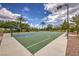 Outdoor basketball court with blue and green surface, set against a backdrop of mature landscaping at 2717 Mona Lisa St, Henderson, NV 89044