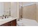 Bright bathroom featuring a tub and shower combo with decorative tile surround at 2717 Mona Lisa St, Henderson, NV 89044