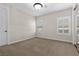 Neutral bedroom featuring mirrored closet doors and bright window shutters at 2717 Mona Lisa St, Henderson, NV 89044