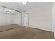 Well-lit bedroom featuring mirrored closet doors and carpet at 2717 Mona Lisa St, Henderson, NV 89044