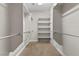 Spacious walk-in closet with hanging rods and shelves at 2717 Mona Lisa St, Henderson, NV 89044