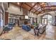 Bright and airy lounge area with stone fireplace and seating at 2717 Mona Lisa St, Henderson, NV 89044