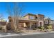 Two-story home with stone and stucco exterior at 2717 Mona Lisa St, Henderson, NV 89044