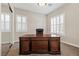 Bright home office with wood desk and window shutters at 2717 Mona Lisa St, Henderson, NV 89044