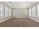 Bright living room featuring neutral walls and plush carpeting at 2717 Mona Lisa St, Henderson, NV 89044