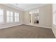 Spacious living room featuring neutral walls and multiple windows with white shutters at 2717 Mona Lisa St, Henderson, NV 89044