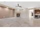 Spacious living room featuring fireplace, tile flooring, and kitchen with island at 2717 Mona Lisa St, Henderson, NV 89044