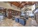 Inviting clubhouse lobby featuring a stone floor, wood trim, a large bookshelf and comfortable seating at 2717 Mona Lisa St, Henderson, NV 89044