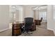 Home office featuring a large wood desk, and ample storage, with natural light streaming through the window at 2717 Mona Lisa St, Henderson, NV 89044