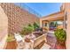 Brick paved backyard with fire pit, grill, and seating at 2744 Drummossie, Las Vegas, NV 89044