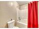 Simple bathroom with shower/tub combo and red shower curtain at 2744 Drummossie, Las Vegas, NV 89044